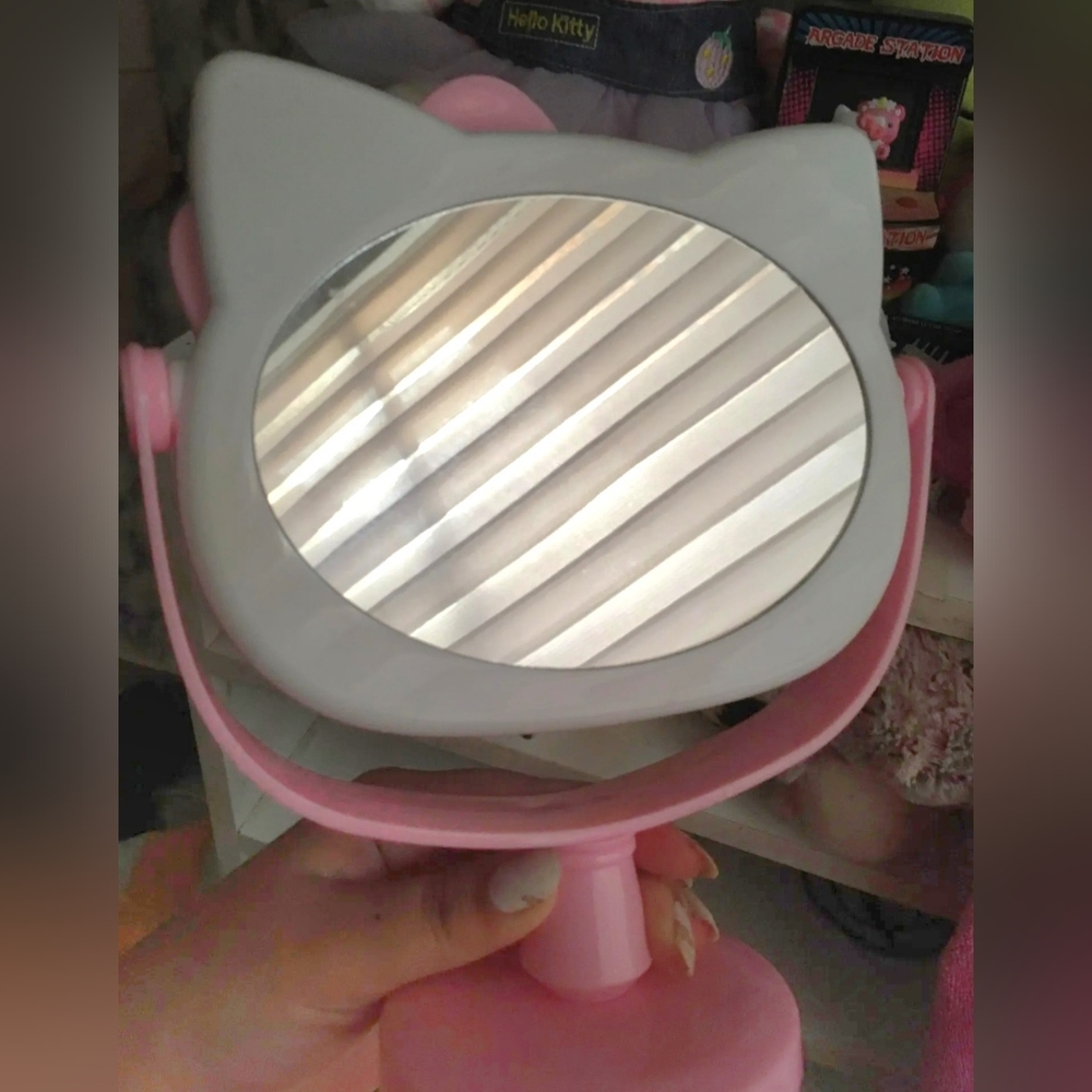 New Hello Kitty pink rotating makeup mirror approximately 8" tall. RED A…